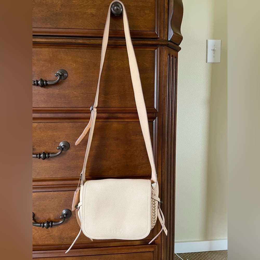 Coach light pink crossbody leather bag good condition, stained from jeans